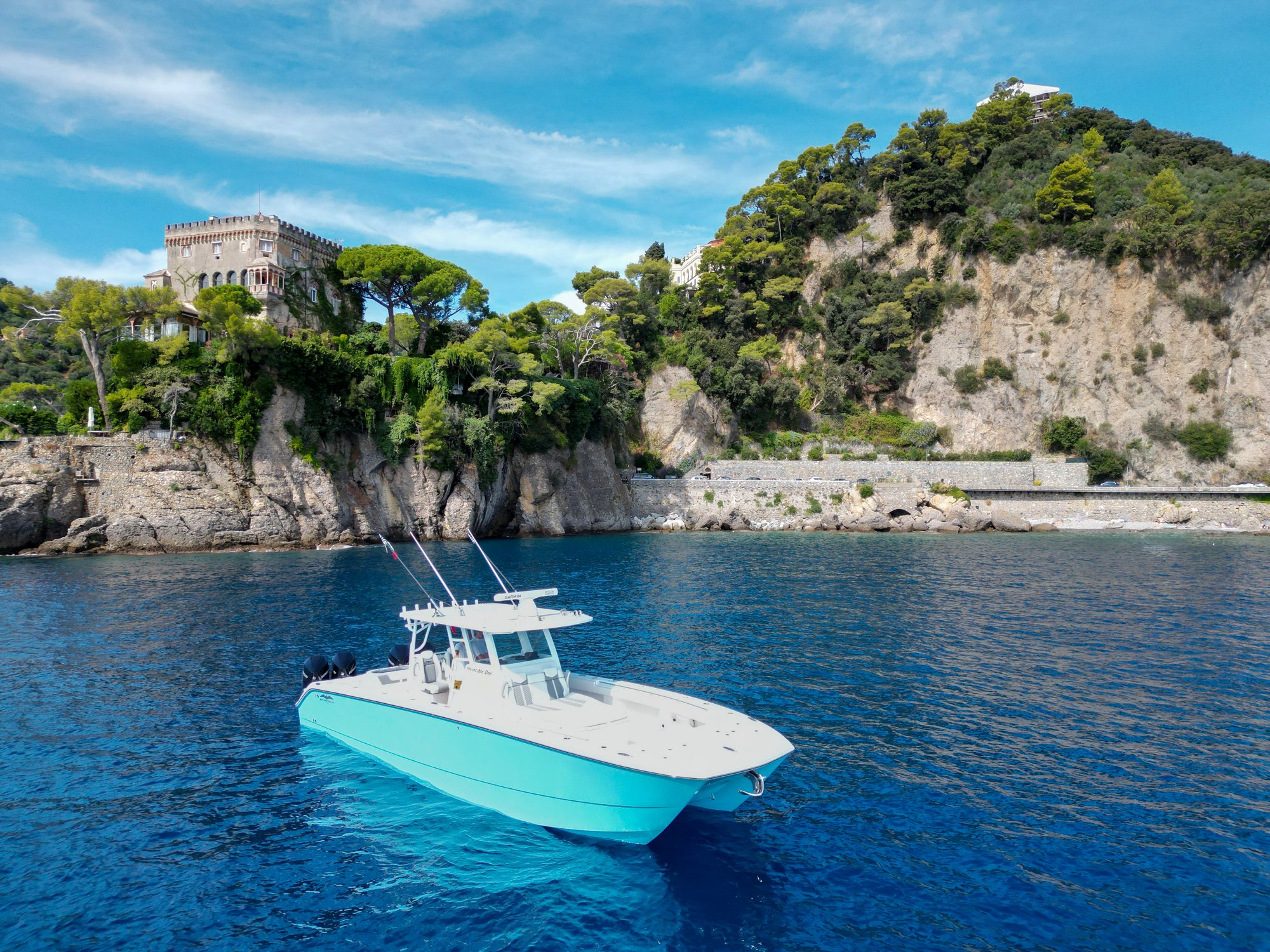 A stunning Invincible Blue 37' Catamaran sits in beautiful Portofino, Italy