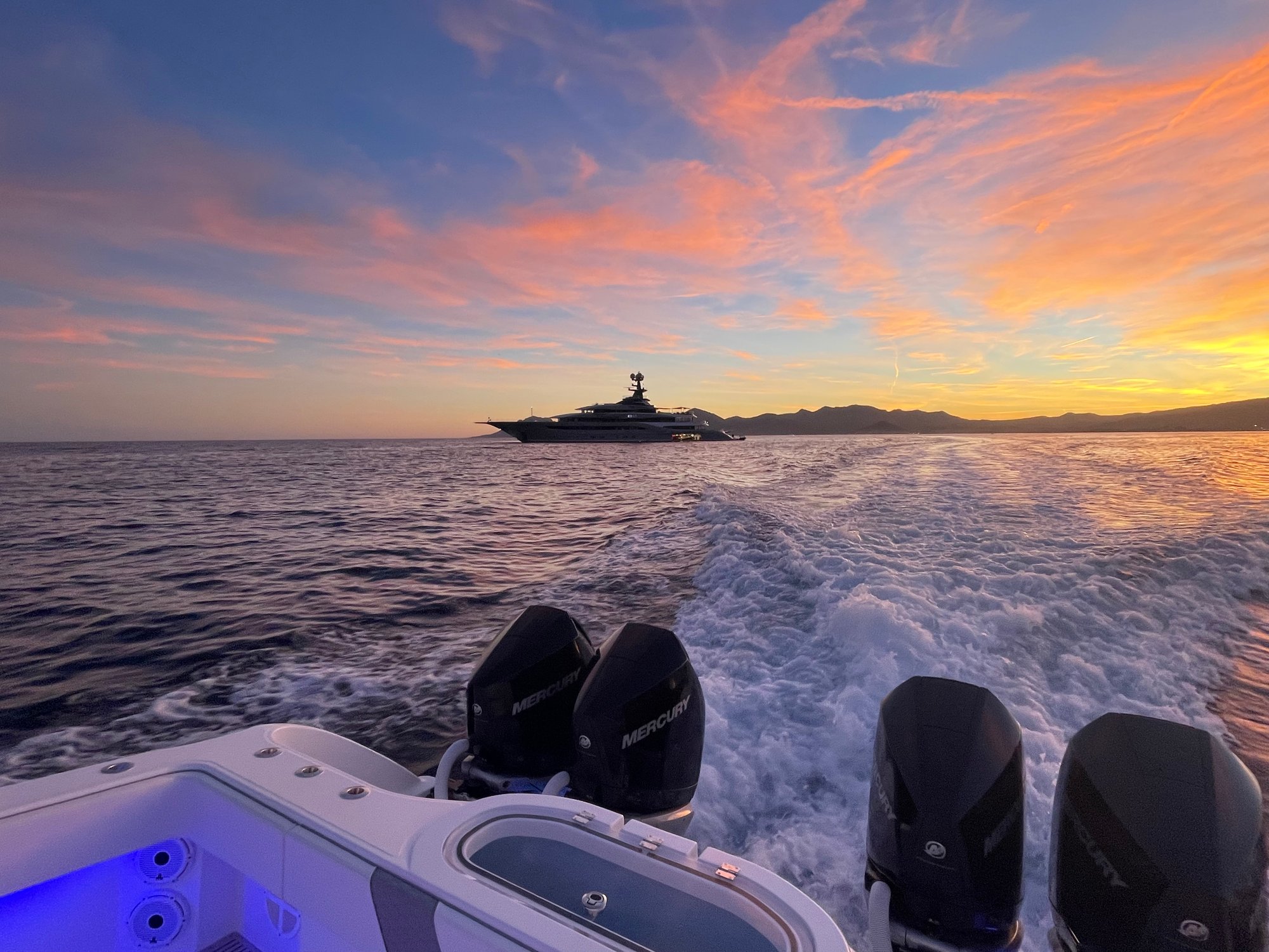 Invincible 37' Catamaran Center Console Powered by Mercury 300 V8 Verados with Motor Yacht Kismet in the background of a stunning Cannes sunset
