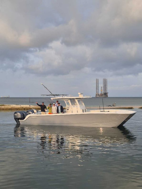 Invincible 35 Catamaran in Port Gentil Gabon in front of an oil rig